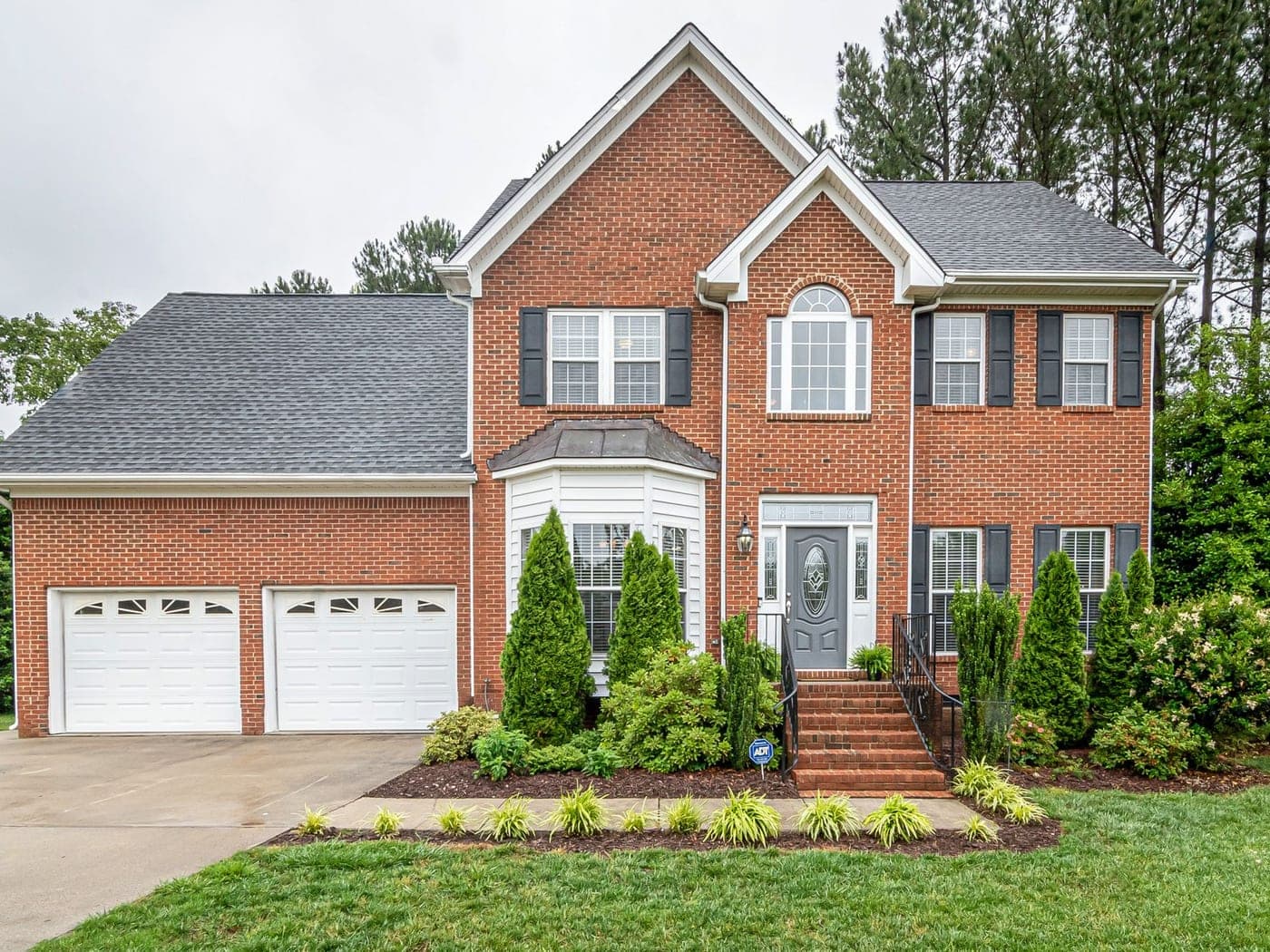 Two-story brick suburban home typical of Ooltewah, TN